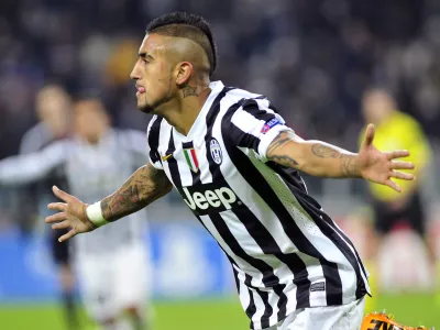 Juventus midfielder Arturo Vidal celebrates after scoring during the Champions League, Group B, soccer match between Juventus and Copenaghen at the Juventus stadium, in Turin, Italy, Wednesday, Nov. 27, 2013. Juventus won 3-1 and Vidal scored an hat-trick. (AP Photo/Massimo Pinca)