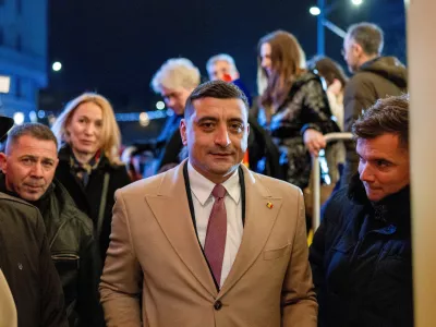 FILE PHOTO: The leader of the radical right Alliance for Uniting Romanians (AUR) party, George Simion, looks on following initial exit polls at the party's campaign headquarters on the day of the parliamentary election, in Bucharest, Romania, December 1, 2024. REUTERS/Alkis Konstantinidis/File Photo