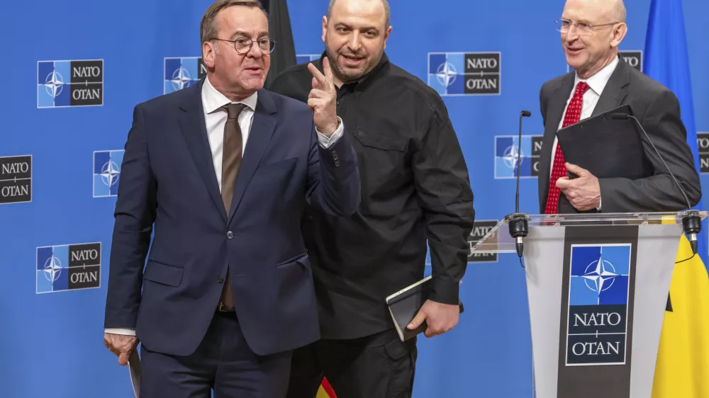 Germany's Defense Minister Boris Pistorius, left, Ukraine's Defense Minister Rustem Umerov, center, and Britain's Defense Secretary John Healey, attend a news conference after a meeting of the Ukraine Defence Contact Group at NATO headquarters in Brussels, Friday, April 11, 2025. (AP Photo/Geert Vanden Wijngaert)