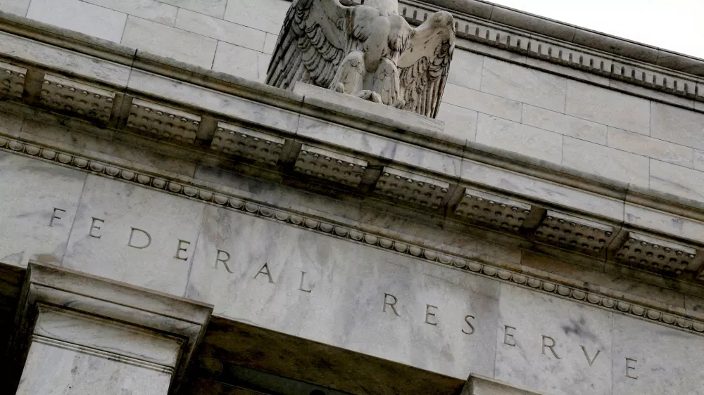 FILE PHOTO: An eagle tops the U.S. Federal Reserve building's facade in Washington, July 31, 2013. REUTERS/Jonathan Ernst//File Photo