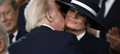 President Donald Trump kisses first lady Melania Trump during the 60th Presidential Inauguration in the Rotunda of the U.S. Capitol in Washington, Monday, Jan. 20, 2025. (AP Photo/Julia Demaree Nikhinson, Pool)