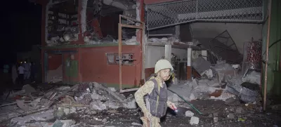 An army soldier examines a building damaged by a suspected Indian missile attack near Muzaffarabad, the capital of Pakistan controlled Kashmir, in Wednesday, May 7, 2025. (AP Photo/M.D. Mughal)