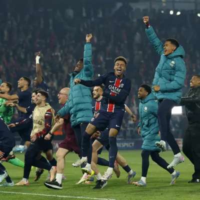 Soccer Football - Champions League - Semi Final - Second Leg - Paris St Germain v Arsenal - Parc des Princes, Paris, France - May 7, 2025 Paris St Germain's Desire Doue celebrates with teammates after the match Action Images via Reuters/Peter Cziborra