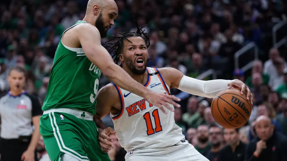 May 7, 2025; Boston, Massachusetts, USA; Boston Celtics guard Derrick White (9) defends against New York Knicks guard Jalen Brunson (11) in the second quarter during game two of the second round for the 2025 NBA Playoffs at TD Garden. Mandatory Credit: David Butler II-Imagn Images