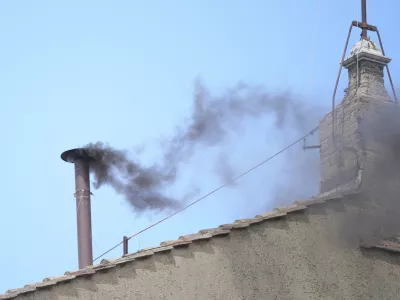 Black smoke billows from the chimney of the Sistine Chapel during the conclave to elect a new pope, at the Vatican, Thursday, May 8, 2025. (AP Photo/Andrew Medichini)