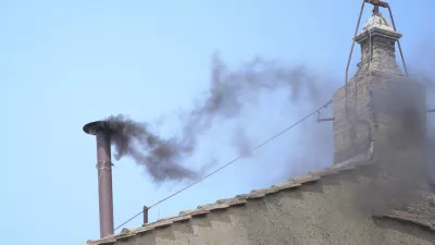 Black smoke billows from the chimney of the Sistine Chapel during the conclave to elect a new pope, at the Vatican, Thursday, May 8, 2025. (AP Photo/Andrew Medichini)