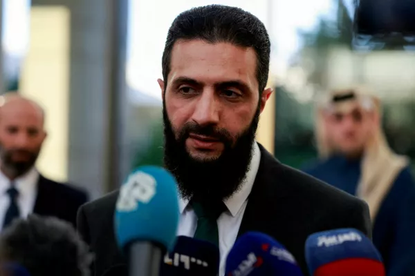 FILE PHOTO: Syria's de facto leader Ahmed al-Sharaa, also known as Abu Mohammed al-Golani, speaks to the media during a meeting with Qatar's Minister of State Mohammed bin Abdulaziz Al-Khulaifi, after the ousting of Syria's Bashar al-Assad, in Damascus, Syria, December 23, 2024. REUTERS/Ammar Awad/File Photo