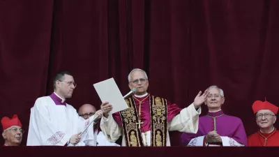 Newly elected Pope Leo XIV addresses the faithful from the balcony of St. Peter's Basilica at the Vatican, Thursday, May 8, 2025. (AP Photo/Alessandra Tarantino)