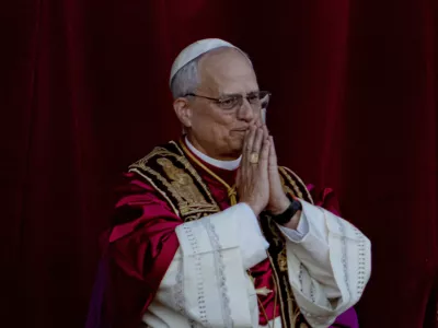 Newly elected Pope Leo XIV, formerly Cardinal Robert Francis Prevost, appears on the central loggia of St. Peter's Basilica at the Vatican shortly after his election as the 267th pontiff of the Roman Catholic Church, Thursday, May 8, 2025. (AP Photo/Domenico Stinellis)
