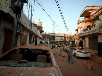 Damaged vehicles are seen in the neighbourhood, following Pakistan's military operation against India, in Rehari, Jammu, May 10, 2025. REUTERS/Stringer