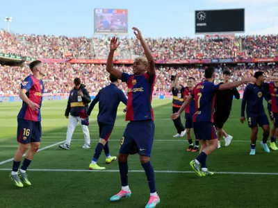 Soccer Football - LaLiga - FC Barcelona v Real Madrid - Estadi Olimpic Lluis Companys, Barcelona, Spain - May 11, 2025 FC Barcelona's Lamine Yamal celebrates after the match with team mates REUTERS/Nacho Doce