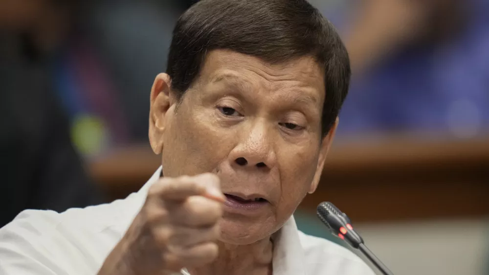 FILE - Former Philippine President Rodrigo Duterte speaks during a senate inquiry on the so-called war on drugs during his administration at the Philippine Senate Monday, Oct. 28, 2024, in Manila, Philippines. (AP Photo/Aaron Favila, File)