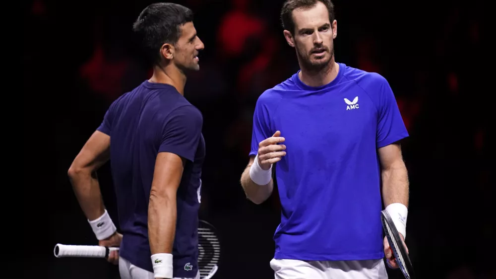 FILED - 22 September 2022, United Kingdom, London: British tennis player Andy Murray (R) speaks with Serbia's Novak Djokovic. Andy Murray's partnership with Novak Djokovic has come to an end after the pair announced they would no longer be working together. Photo: John Walton/PA Wire/dpa