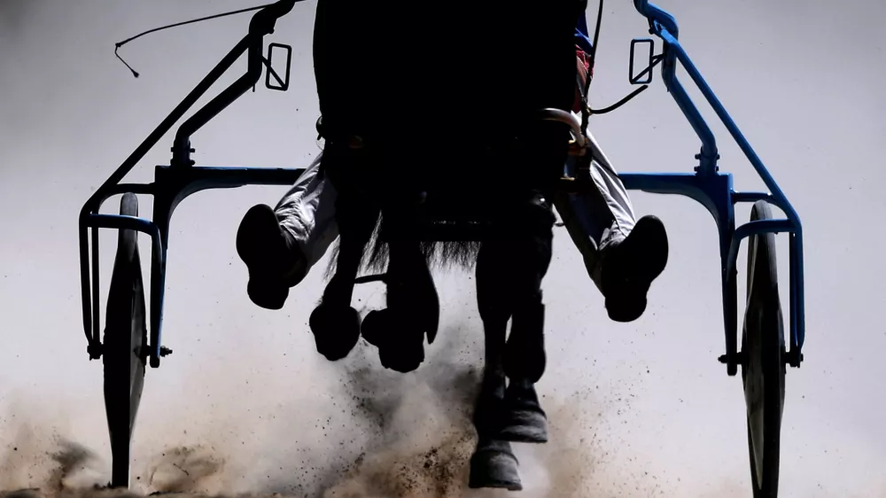 A jockey competes during Harness Racing in York, Britain, May 10, 2025. REUTERS/Lee Smith  TPX IMAGES OF THE DAY