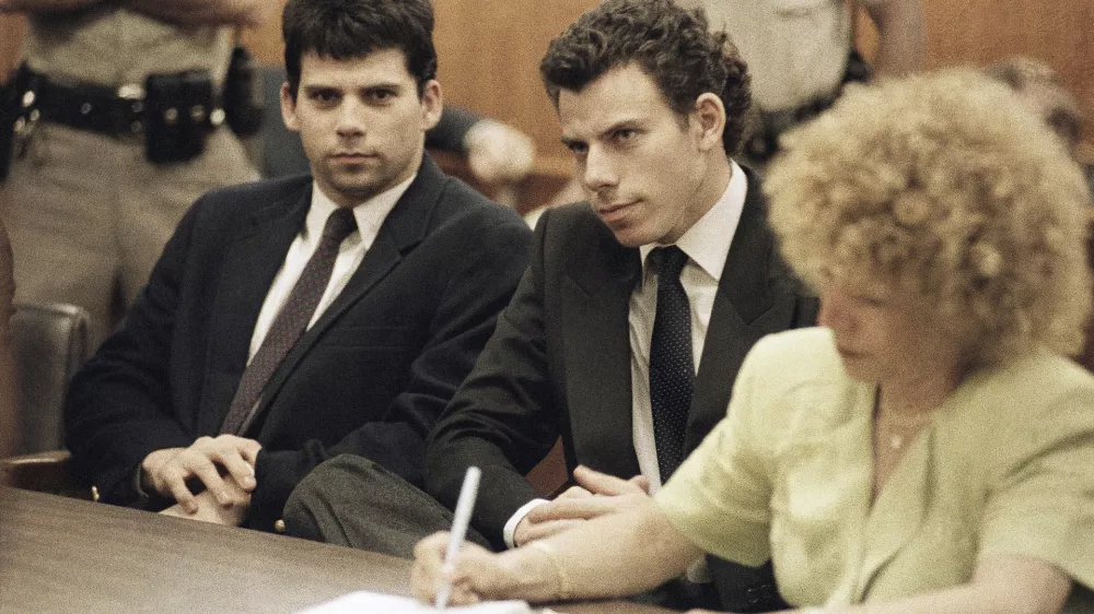 FILE - Lyle, left, and Erik Galen Menendez sit in Beverly Hills, Calif., courtroom, May 14, 1990 as a judge postponed their preliminary hearing on charges of murdering their parents last August. (AP Photo/Kevork Djansezian, File)