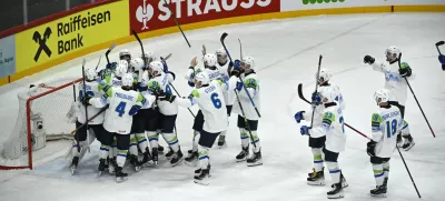 Slovenia's team celebrates winning following the IIHF Ice Hockey World Championship group A match between France and Slovenia in Stockholm, Sweden, Monday, May 19, 2025. (Fredrik Sandberg/TT News Agency via AP)