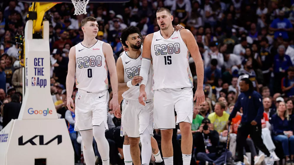May 15, 2025; Denver, Colorado, USA; Denver Nuggets guard Jamal Murray (27) and center Nikola Jokic (15) and guard Christian Braun (0) in the fourth quarter against the Oklahoma City Thunder during game six of the second round for the 2025 NBA Playoffs at Ball Arena. Mandatory Credit: Isaiah J. Downing-Imagn Images