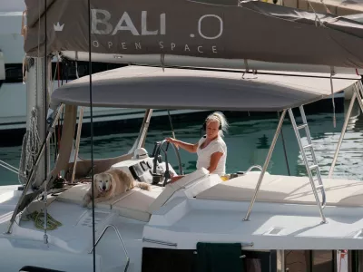 Italy, Sicily, Mediterranean Sea, Marina di Ragusa (Ragusa Province); 16 October 2024, woman with a dog on a catamaran sailing boat in the port - EDITORIAL,Image: 923263012, License: Royalty-free, Restrictions: Contributor country restriction: Worldwide, Worldwide.Contributor usage restriction: Advertising and promotion, Consumer goods.Contributor media restriction: {737D514E-C716-4118-A18D-E772FFAD13E9}, {737D514E-C716-4118-A18D-E772FFAD13E9}., Model Release: no