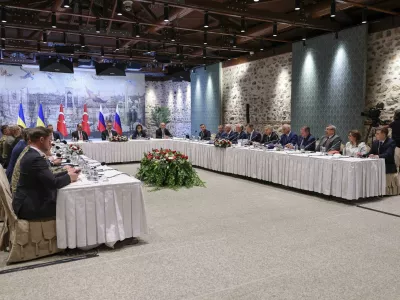 In this handout photo released by Turkish Foreign Ministry, Turkish Foreign Minister Hakan Fidan, center, chairs a meeting between delegations from Russia, right, and Ukraine, left, at Dolmabahce palace in Istanbul, Turkey, Friday, May 16, 2025. (Murat Gok/Turkish Foreign Ministry via AP)