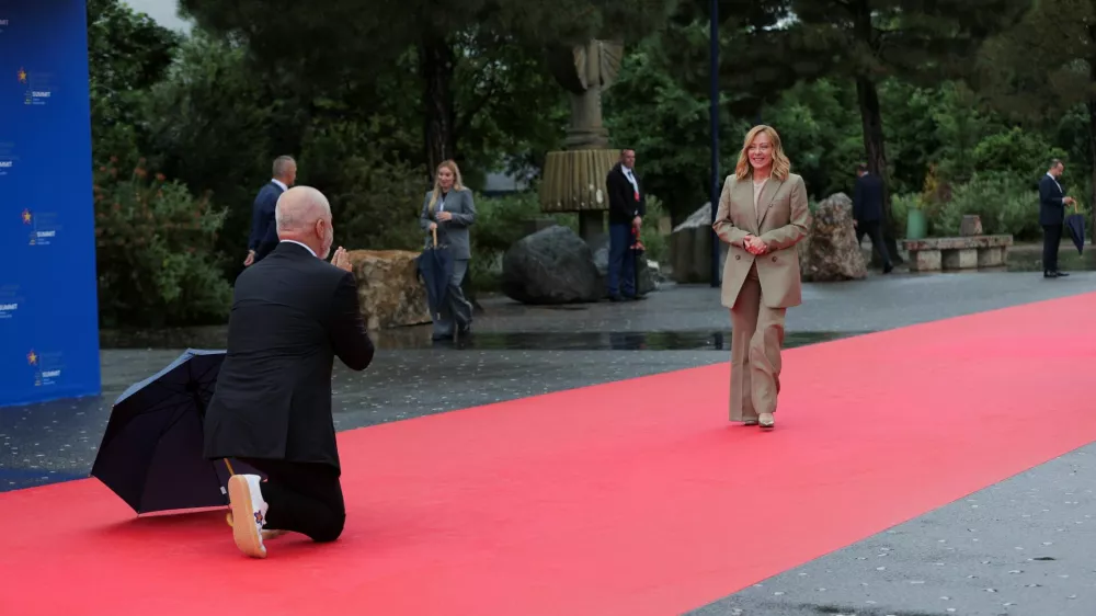Albania's Prime Minister Edi Rama welcomes Italy's Prime Minister Giorgia Meloni during the European Political Community Summit at Skanderbeg Square in Tirana, Albania, May 16, 2025. REUTERS/Valdrin Xhemaj