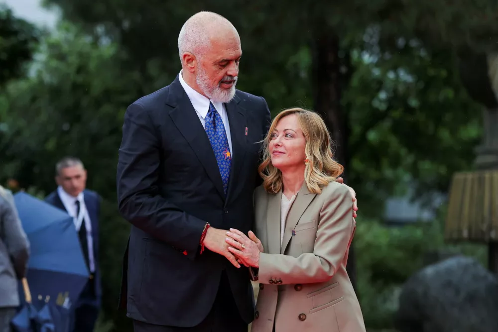 Albania's Prime Minister Edi Rama welcomes Italy's Prime Minister Giorgia Meloni during the European Political Community Summit at Skanderbeg Square in Tirana, Albania, May 16, 2025. REUTERS/Valdrin Xhemaj