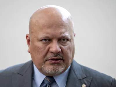 FILE - Karim Khan, Prosecutor of the International Criminal Court looks up prior to a press conference in The Hague, Netherlands, July 3, 2023. (AP Photo/Peter Dejong, File)
