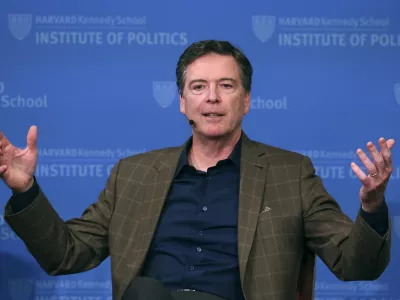 FILE - Former FBI director James Comey gestures while speaking at Harvard University's Institute of Politics' JFK Jr. Forum in Cambridge, Mass., Feb. 24, 2020. (AP Photo/Charles Krupa, File)