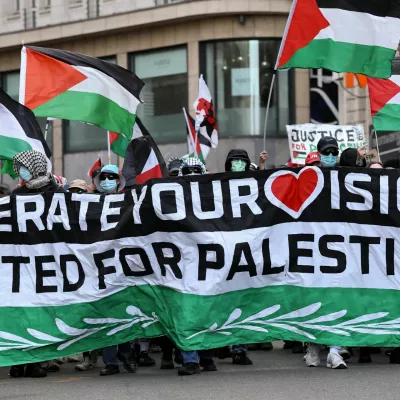 Pro-Palestinian demonstrators hold flags during a protest, on the day of the Grand Final of the 2025 Eurovision Song Contest in Basel, Switzerland, May 17, 2025. REUTERS/Christian Hartmann