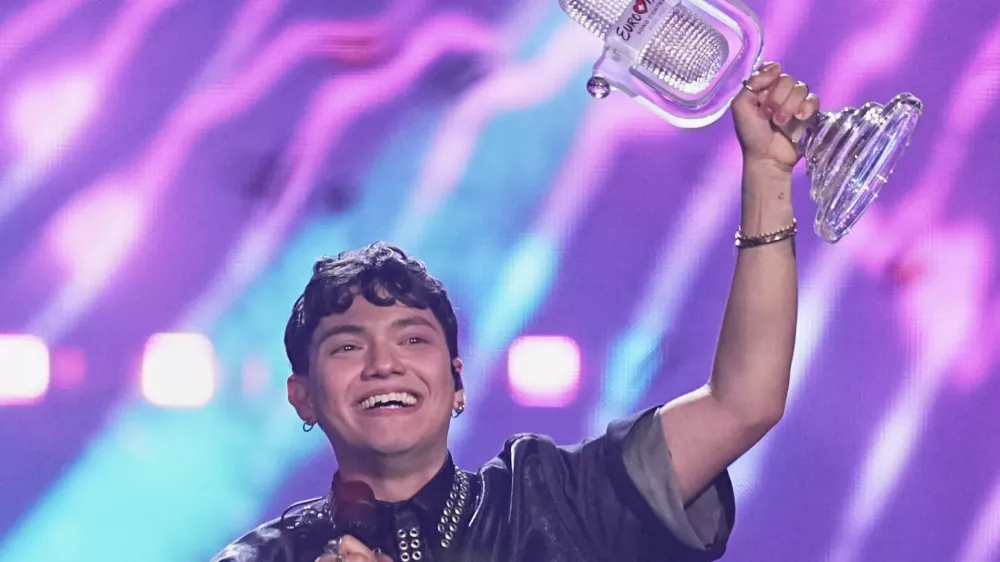 Winner of the Eurovision Song Contest JJ from Austria holds up the trophy onstage, he won with the song "Wasted Love" during the Grand Final of the 69th Eurovision Song Contest, in Basel, Switzerland, early Sunday, May 18, 2025. (AP Photo/Martin Meissner)