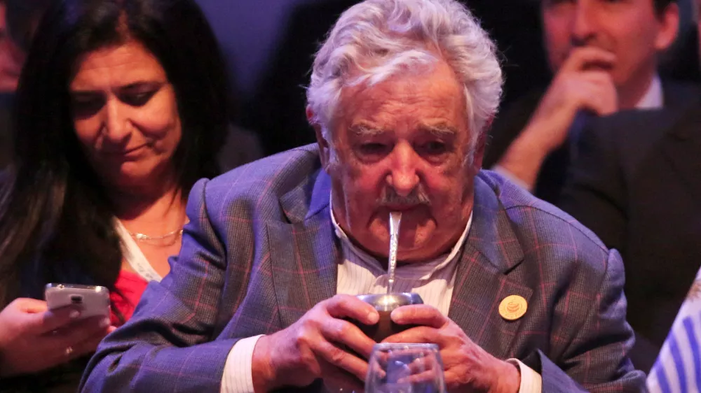 FILE PHOTO: Uruguay's President Jose Mujica drinks "mate", a traditional herbal infusion, at the opening ceremony of the Community of Latin American and Caribbean States (CELAC) summit in San Antonio de Belen province of Heredia, in this January 28, 2015 handout courtesy of the Costa Rica Presidency. REUTERS/Costa Rica Presidency/Handout via Reuters/File Photo. ATTENTION EDITORS - THIS PICTURE WAS PROVIDED BY A THIRD PARTY. REUTERS IS UNABLE TO INDEPENDENTLY VERIFY THE AUTHENTICITY, CONTENT, LOCATION OR DATE OF THIS IMAGE. FOR EDITORIAL USE ONLY. NOT FOR SALE FOR MARKETING OR ADVERTISING CAMPAIGNS. THIS PICTURE IS DISTRIBUTED EXACTLY AS RECEIVED BY REUTERS, AS A SERVICE TO CLIENTS.