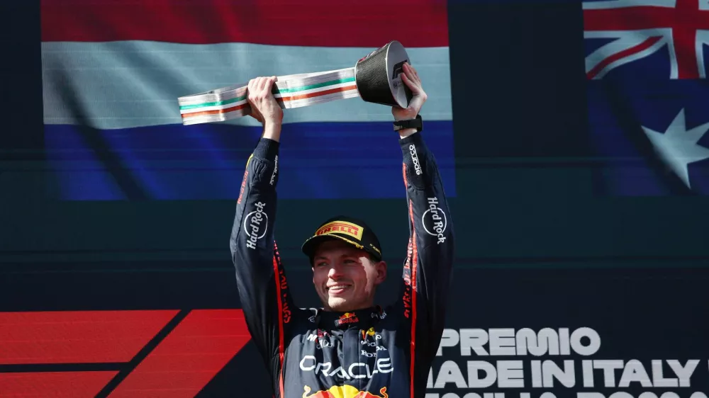 Formula One F1 - Emilia Romagna Grand Prix - Autodromo Enzo e Dino Ferrari, Imola, Italy - May 18, 2025 Red Bull's Max Verstappen celebrates on the podium with a trophy after winning the Emilia Romagna Grand Prix REUTERS/Jakub Porzycki