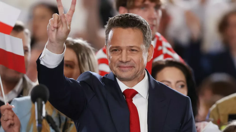 Warsaw Mayor Rafal Trzaskowski, the presidential candidate of the Civic Coalition reacts to the exit poll for the first round of Poland's presidential election, in Sandomierz, Poland, May 18, 2025. REUTERS/Kacper Pempel