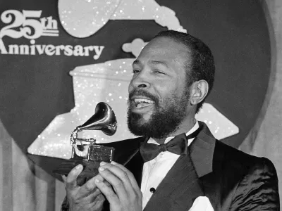 Marvin Gaye kisses his Grammy Award after he was named top Rhythm & Blues Male Vocalist at the 25th annual Grammy Awards presentation, Wednesday, Feb. 24, 1983, Los Angeles, Calif. Gaye received two Grammys for Best R & B Instrumental Performance and R & B Male Vocalist for his hit song Sexual Healing. (AP Photo)