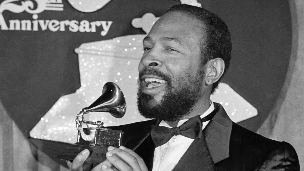 Marvin Gaye kisses his Grammy Award after he was named top Rhythm & Blues Male Vocalist at the 25th annual Grammy Awards presentation, Wednesday, Feb. 24, 1983, Los Angeles, Calif. Gaye received two Grammys for Best R & B Instrumental Performance and R & B Male Vocalist for his hit song Sexual Healing. (AP Photo)