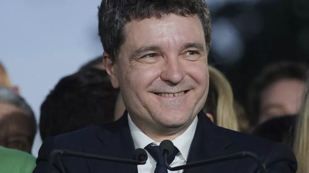 Presidential candidate Nicusor Dan speaks to media after polls closed for the second round of the country's presidential election redo in Bucharest, Romania, Sunday, May 18, 2025. (AP Photo/Andreea Alexandru)