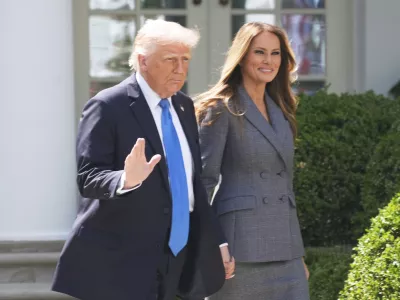 President Donald Trump and first lady Melania Trump arrive in the Rose Garden at the White House, Monday, May 19, 2025 in Washington, where President Trump will sign the "Take It Down Act". (AP Photo/Manuel Balce Ceneta)