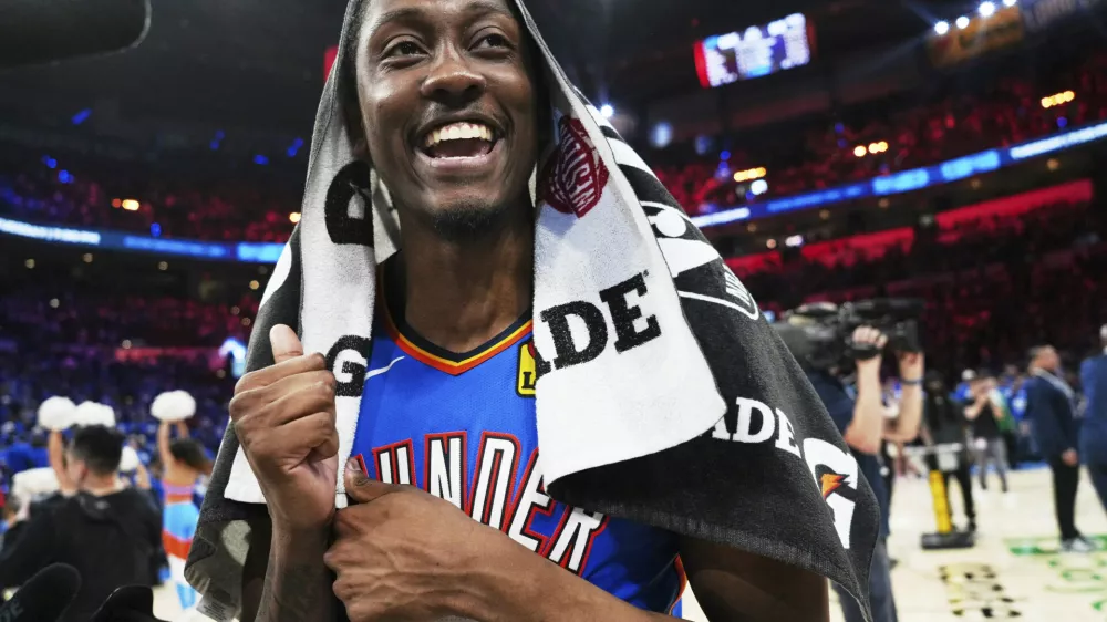 Oklahoma City Thunder's Jalen Williams celebrates as he walks off the court after the team's win against the Denver Nuggets in Game 7 in the Western Conference semifinals of the NBA basketball playoffs, Sunday, May 18, 2025, in Oklahoma City. (AP Photo/Kyle Phillips)