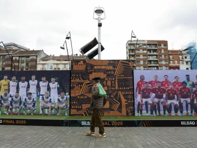 Soccer Football - Europa League - Final - Preview - Tottenham Hotspur v Manchester United - Bilbao, Spain - May 19, 2025 A person walks in a fan zone ahead of the Europa League final REUTERS/Vincent West
