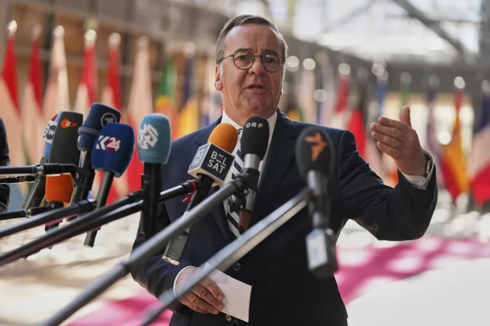 Germany's Defense Minister Boris Pistorius speaks with the media as he arrives for a meeting of EU defense ministers at the European Council building in Brussels, Tuesday, May 20, 2025. (AP Photo/Virginia Mayo)