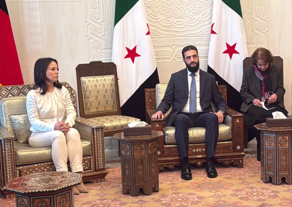 03 January 2025, Syria, Damascus: Germany's Foreign Minister Annalena Baerbock meets with Syria's new leader, Ahmed al-Sharaa, at the presidential palace in Damascus. Baerbock is on a surprise visit to Syria, roughly four weeks after the fall of long-term ruler Bashar al-Assad. Photo: J&ouml;rg Blank/dpa