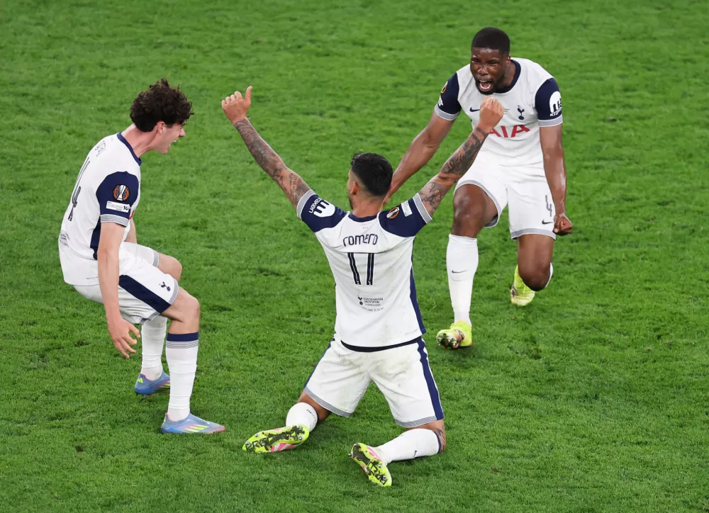 Soccer Football - Europa League - Final - Tottenham Hotspur v Manchester United - San Mames, Bilbao, Spain - May 21, 2025  Tottenham Hotspur's Kevin Danso, Cristian Romero and Archie Gray celebrate winning the Europa League REUTERS/Juan Medina