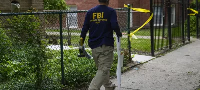 An official works at the scene of an address listed as the home of Elias Rodriguez, who police identified as the suspect in the killing of 2 staff members of the Israeli Embassy in Washington, Thursday, May 22, 2025, in Chicago. (AP Photo/Erin Hooley)