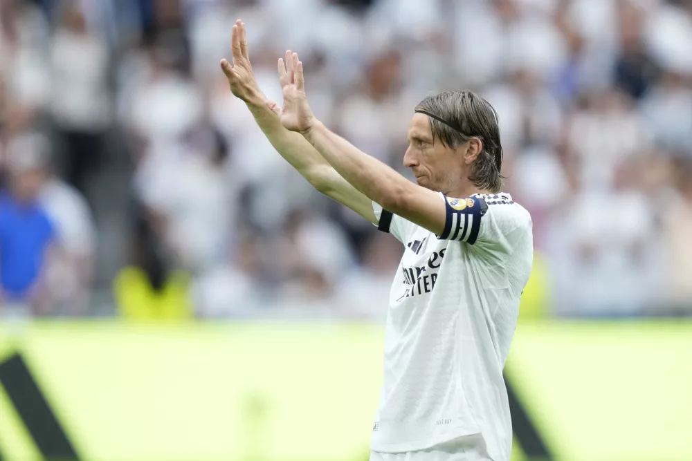 Real Madrid's Luka Modric waves during a Spanish La Liga soccer match against Real Sociedad at Santiago Bernabeu stadium in Madrid, Saturday, May 24, 2025. (AP Photo/Cesar Cebolla)