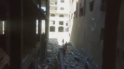 This photo provided by Breaking the Silence, a whistleblower group of former Israeli soldiers, shows two soldiers behind Palestinian detainees being sent into a Gaza City-area house to clear it in 2024. (Breaking the Silence via AP)