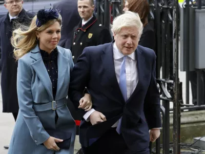 FILE - In this Monday, March 9, 2020 file photo Britain's Prime Minister Boris Johnson and his partner Carrie Symonds arrive to attend the annual Commonwealth Day service at Westminster Abbey in London. Boris Johnson and his partner Carrie Symonds have announced she gave birth to a "healthy baby boy at a London hospital earlier this morning&acirc;&euro;ť Wednesday April 29, 2020, and both mother and baby are doing well. (AP Photo/Kirsty Wigglesworth, File)