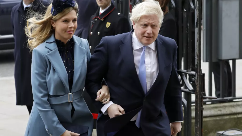 FILE - In this Monday, March 9, 2020 file photo Britain's Prime Minister Boris Johnson and his partner Carrie Symonds arrive to attend the annual Commonwealth Day service at Westminster Abbey in London. Boris Johnson and his partner Carrie Symonds have announced she gave birth to a "healthy baby boy at a London hospital earlier this morning&acirc;&euro;ť Wednesday April 29, 2020, and both mother and baby are doing well. (AP Photo/Kirsty Wigglesworth, File)