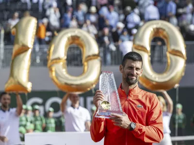 Winner Novak Djokovic of Serbia poses with the trophy after the final match of the ATP 250 Geneva Open tennis against Hubert Hurkacz of Poland, in Geneva, Switzerland, Saturday, May 24, 2025. (Martial Trezzini/Keystone via AP)