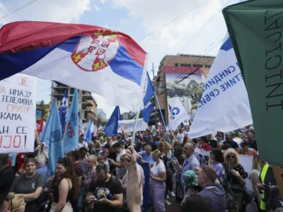 University students and people protest in front of the government building, six months after the deadly train station tragedy that sparked mass demonstrations against corruption, in Belgrade, Serbia, Thursday, May 1, 2025. (AP Photo/Darko Vojinovic)