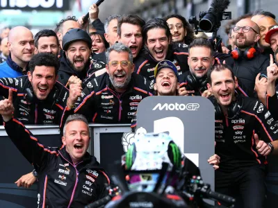 MotoGP - British Grand Prix - Silverstone Circuit, Silverstone, Britain - May 25, 2025 Aprilia Racing's Marco Bezzecchi celebrates with his team after winning the MotoGP race Action Images via Reuters/Andrew Boyers