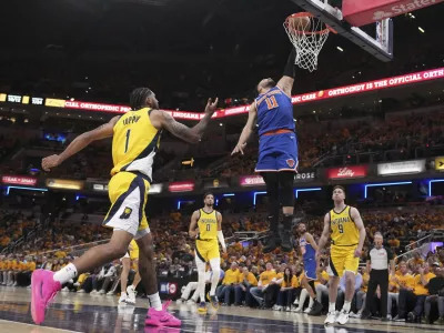 New York Knicks guard Jalen Brunson (11) shoots against the Indiana Pacers during the second half of Game 3 of the Eastern Conference finals of the NBA basketball playoffs Sunday, May 25, 2025, in Indianapolis. (AP Photo/AJ Mast)